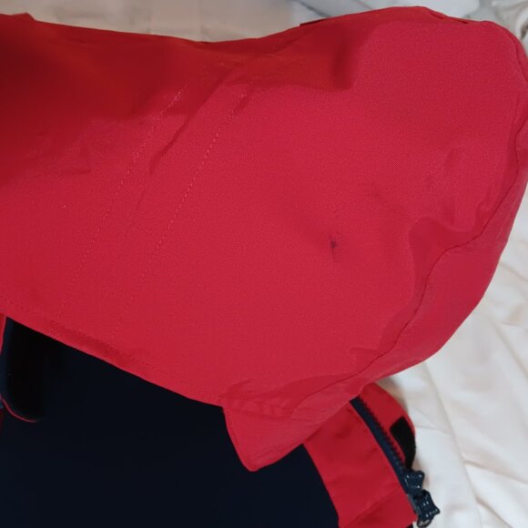 The iconic Abercrombie & Kent expedition red winter coat with blue lining. - Picture 10 of 10